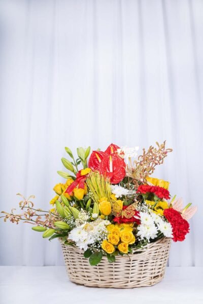 Basket Arrangements Flower Arrangement Of Yellow Roses, Red Carnation With Red Anthurium