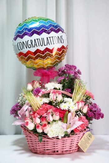 Basket Arrangements Flower Arrangement Of Jumilia Roses, Light Pink Carnation With Congratulation Balloon