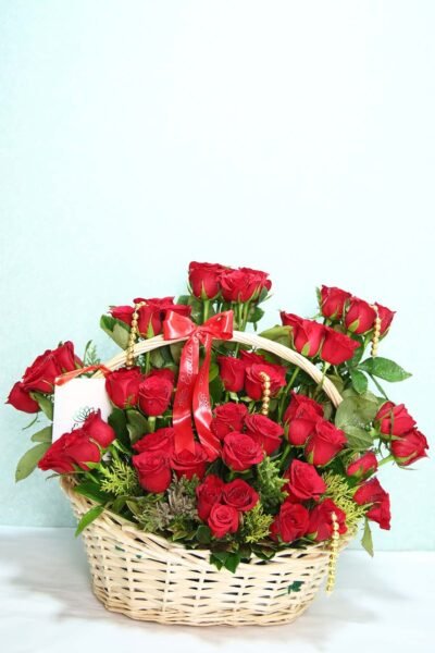 Basket Arrangements Flower Arrngement Of Red Roses With Golden Pearls In Natural Basket