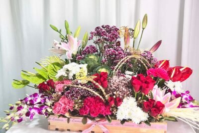 Fresh Flowers Flower Arrangement Of Red Roses, Purple Daisy, Lily, Brassica, With Supari Mocha