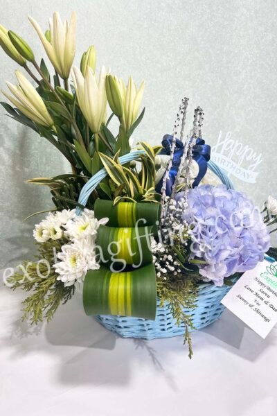 Basket Arrangements Flower Arrangement of Blue Hydrangea With Exotic Leaf