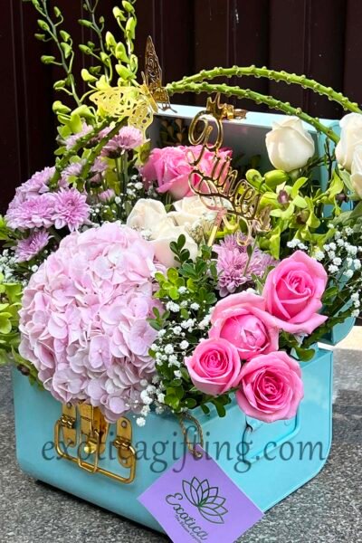 Fresh Flowers Blue Metal Trunk Arrangement of Revival Roses, White Roses & Green Orchids With Hydrangea